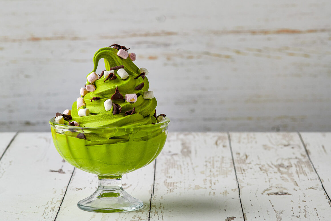 simple image of matcha ice cream in a glass bowl with mini marshmallows and chocolate shavings. shot by professional food photographer for lakeland dairies